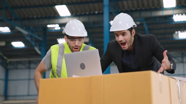 Two factory worker celebrate success together in the factory — Stock Photo, Image