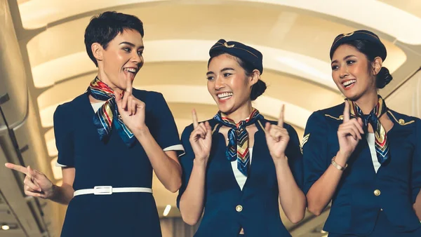 Cabin crew dancing with joy in airplane — Stock Photo, Image