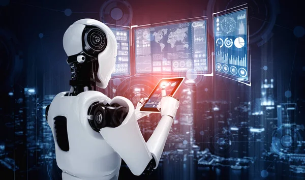 Robot humanoïde utilisant un ordinateur tablette pour l'analyse de mégadonnées — Photo