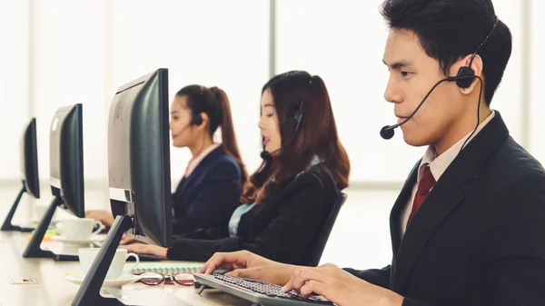 Business people wearing headset working in office — Stock Photo, Image