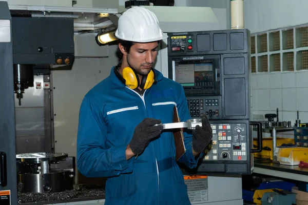 Smart factory worker or engineer do machine job in manufacturing workshop