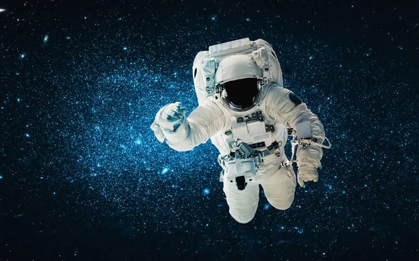 Astronaut spaceman do spacewalk while working for space station