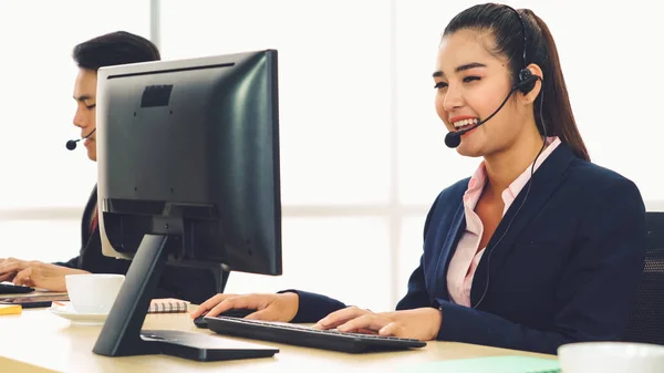 Business people wearing headset working in office — Stock Photo, Image