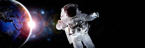 Astronaut spaceman do spacewalk while working for space station