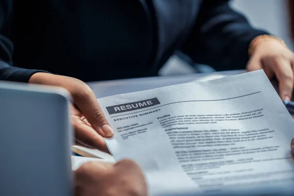 Candidate hands resume to the interviewer. — Stock Photo, Image