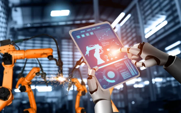 Mechanisierte Industrieroboter und Roboterarme für die Montage in der Fabrikproduktion . — Stockfoto