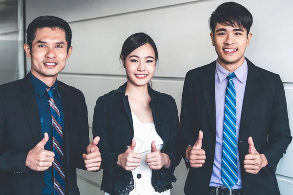 Many happy business people do thumps up sign. — Stock Photo, Image