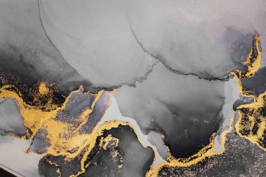 Kağıt üzerinde mermer sıvı mürekkep resminin koyu altın soyut arkaplanı .