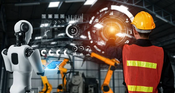 Mechanized industry robot and human worker working together in future factory — Stock Photo, Image