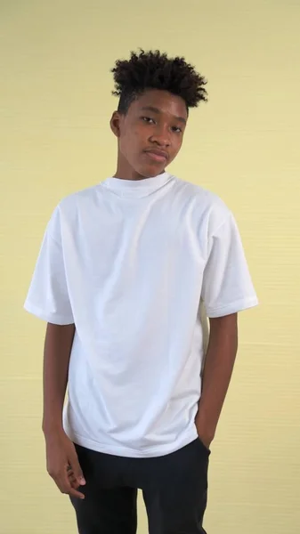 Portrait of young African American teenager merrily pose in studio — Stock Photo, Image