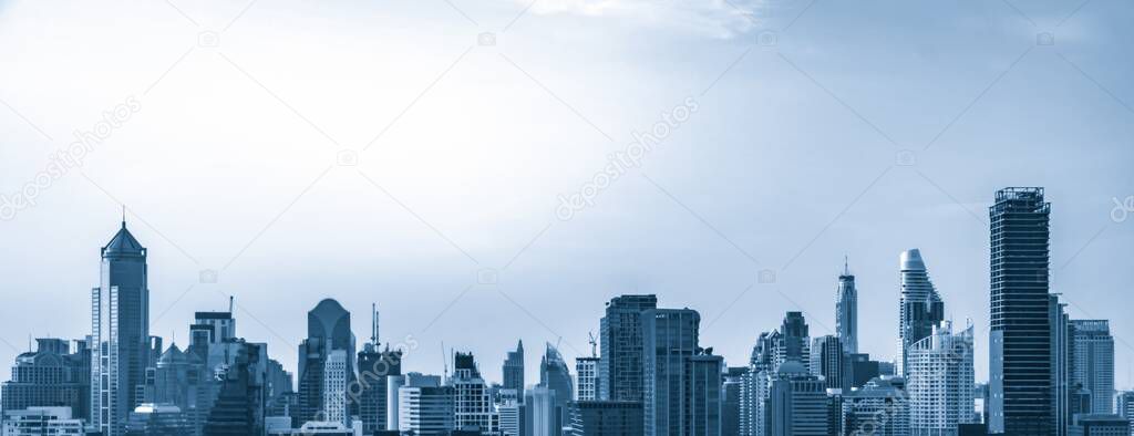 Blue-filtered cityscape and high-rise buildings in metropolis city center