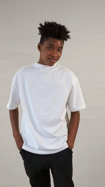 Portrait of young African American teenager merrily pose in studio — Stock Photo, Image