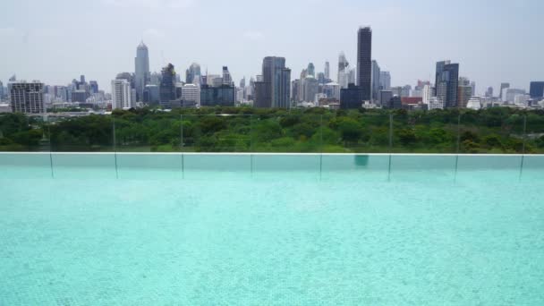 Cityscape and high-rise buildings in metropolis city with water reflection — Stock Video