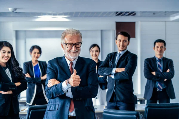 Senior executive CEO manager with team members. — Stock Photo, Image