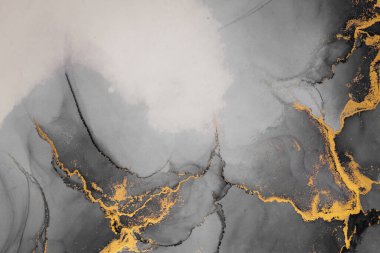 Kağıt üzerinde mermer sıvı mürekkep resminin koyu altın soyut arkaplanı .