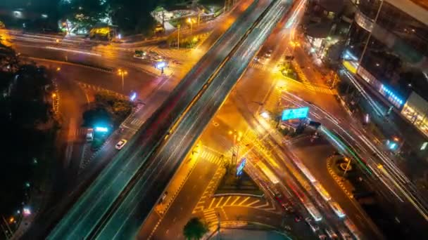 Time lapse of busy highway road junction in metropolis city center at night — Stock Video