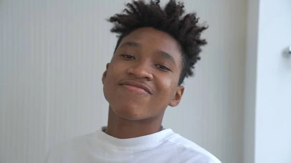 Portrait of young African American teenager merrily pose in studio — Stock Photo, Image