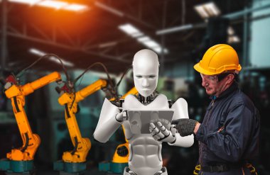 Mekanize endüstri robotu ve insan işçileri gelecekteki fabrikada birlikte çalışıyorlar.
