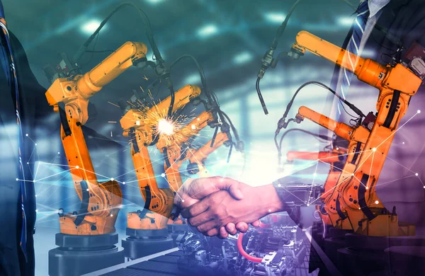 Mechanizovaný průmysl robot rameno a business handshake dvojitá expozice — Stock fotografie