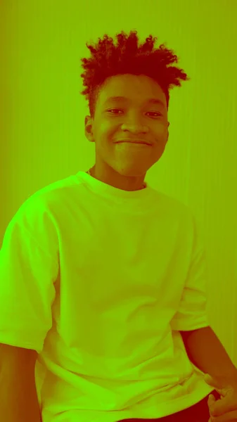 Duotone or half tone portrait of young african american man in studio — Stock Photo, Image