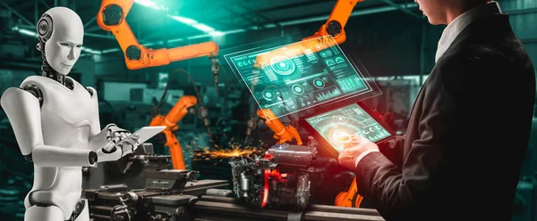 Zmechanizowany robot przemysłowy i pracownik ludzki współpracujący w przyszłej fabryce — Zdjęcie stockowe