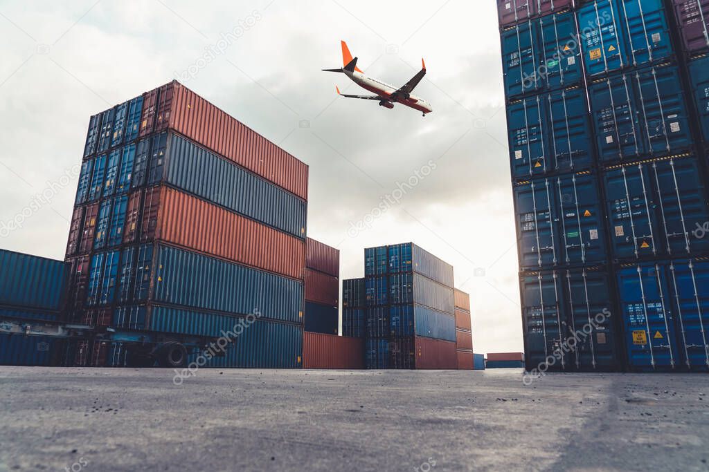 Freight airplane flying above overseas shipping container