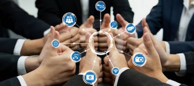 A dynamic group of professionals demonstrates teamwork with thumbs up, surrounded by digital media icons symbolizing communication, collaboration, and modern workplace connectivity. Amity