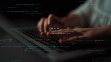 Close-up view of hands actively typing on a laptop keyboard, surrounded by illuminated lines of programming code, showcasing a modern and dynamic digital workspace atmosphere. Xenic