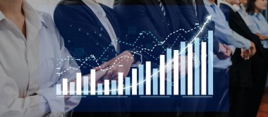Business professionals examine data trends on a digital display, showcasing a growing graph, symbolizing teamwork, strategy, and success in a modern office setting. Axiom