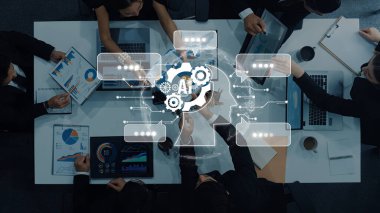 Busy business team collaborates in a modern office setting, using digital tools for data analysis and brainstorming innovative strategies for growth and success. Trope