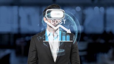 A businessman utilizes virtual reality technology to explore cost trends and analyze financial data in a modern office. This digital approach enhances strategic decision-making. Raster