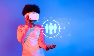 A young woman explores audience segmentation using a virtual reality headset, embodying modern marketing strategies focused on client targeting and business growth. XDMCP