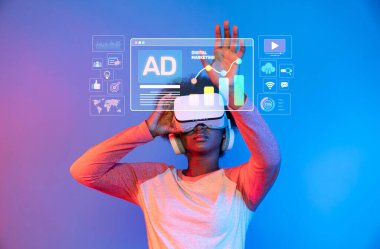 A young individual explores digital marketing concepts through virtual reality, illustrating the intersection of technology and social media engagement in a modern setting. XDMCP