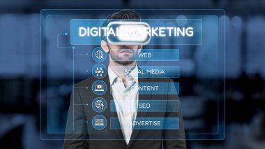 A professional man using a virtual reality headset to engage in digital marketing, showcasing strategies for web, social media, SEO, and advertisement in a modern workspace. Raster