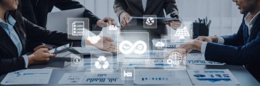 A professional business meeting showcasing collaboration and data analysis. Digital icons emphasize technology, sustainability, and innovative strategies for success. Trope