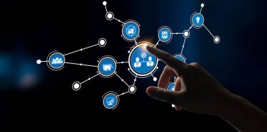 A hand touching a digital interface filled with various technology icons symbolizes networking, communication, and innovation in today digital age. Tessel