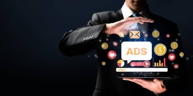 Bir işadamı, karanlık bir arkaplana karşı hazırlanan ve tıklama, gelir ve bağlılığı temsil eden dinamik sembollerle çeşitli online reklam kavramlarını sergiliyor. XDMCP