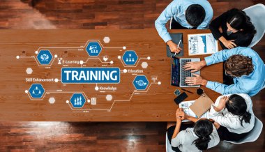 Eğitim ve beceri geliştirme kavramlarını temsil eden dijital görsellerle birlikte eğitim stratejilerine odaklanan dinamik bir çalışma alanı sahnesi. Dostluk