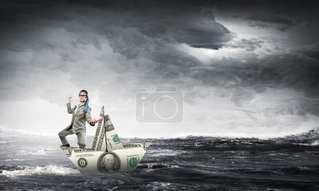 Man in dollar boat