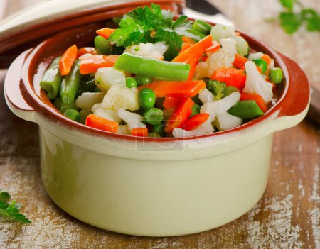 Photo for Mixed vegetables in  bowl on a  wooden board. Selective focus - Royalty Free Image