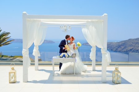 Photo for Beautiful young couple bride and groom celebrate wedding on Santorini - Royalty Free Image