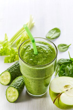 Photo for Glass of healthy green vegetable and fruit smoothie - Royalty Free Image