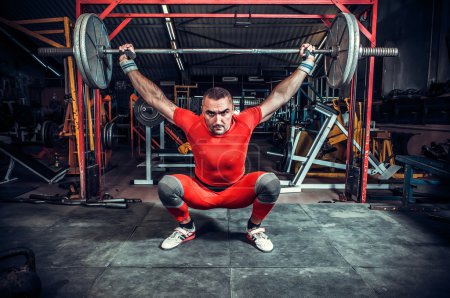 Photo for Powerlifter with strong arms lifting weights - Royalty Free Image