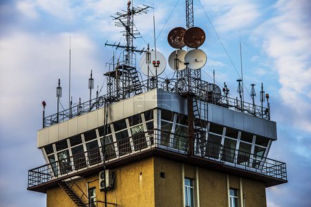 Photo for Air Traffic Control tower essential to aircraft operations at a busy airport - Royalty Free Image