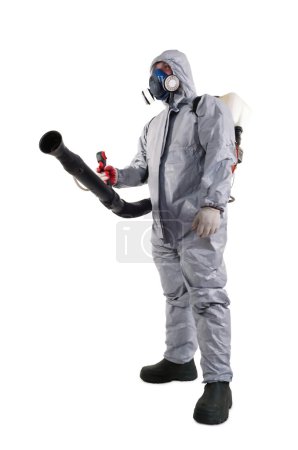 Photo for A pest control worker wearing a mask, hood, protective suit and dual air filters holding a hose to help exterminate rats and other vermin. - Royalty Free Image