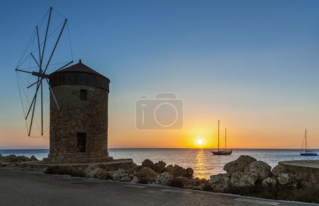 Photo for Attraction of the island of Rhodes is the capital of the ancient port of Mandraki. Statue "Colossus of Rhodes", part of the seven wonders of the world, cast in bronze, was established in this port. - Royalty Free Image