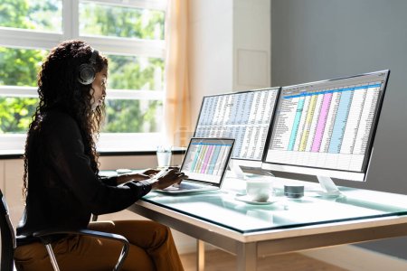 Photo for Data Analyst African Woman Using Spreadsheet On Computer - Royalty Free Image