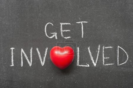 Photo for Get involved phrase handwritten on school blackboard with heart symbol instead of O - Royalty Free Image