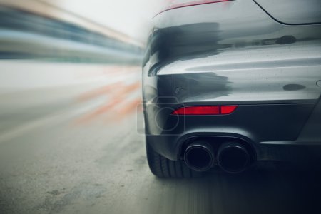 close up of car riding on highway from back Poster 71195353