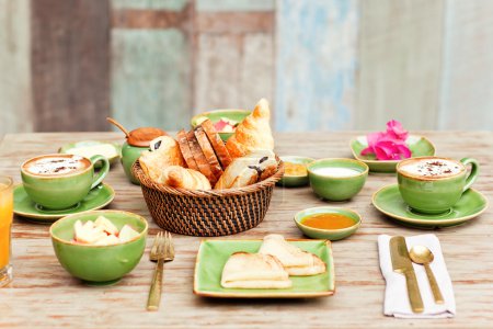 Breakfast in the garden with coffee and a simple food. Good mood for all day.